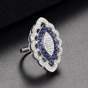 Art Deco marquise ring with blue sapphire zircon and pavé crystals in silver setting
