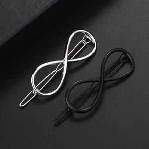 Set de pinzas para el cabello con símbolo infinito en acabados plata y negro mate