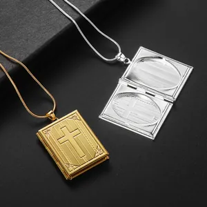 Macro detail of openable bible-style cross locket necklaces in gold and silver finish