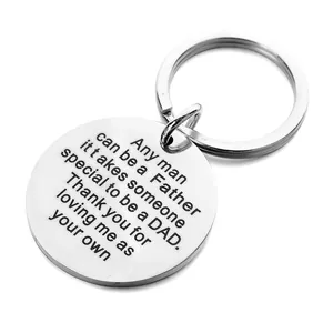 Detailed macro view of the polished stainless steel keychain with engraved quote