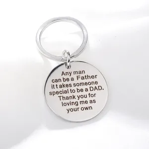 Polished stainless steel round keychain with engraved tribute quote on white silk background