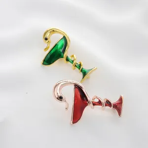 Artistic cocktail glass and swan brooch set in gold and rose gold with enamel inlay