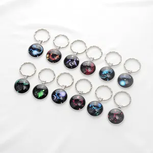 Set de 12 llaveros del zodiaco galaxia con cabujones de cristal y anillas de metal