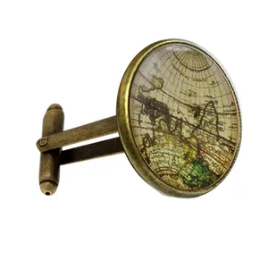 Vintage bronze world map cufflinks with glass dome cover on a clean white background