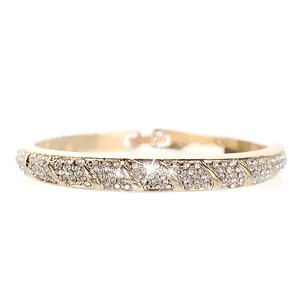 Detail shot of the gold plated open bangle with pavé set sparkling white crystals