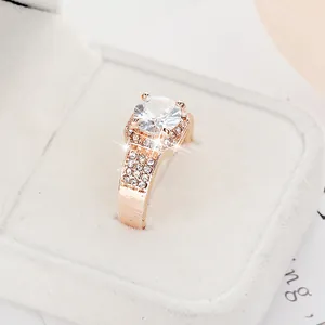 Close-up of a rose gold zircon ring with a large round center stone in a gift box
