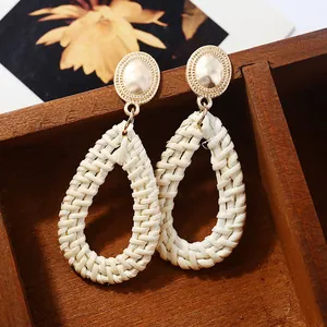 Bohemian teardrop woven rattan drop earrings with gold hammered metal stud design