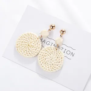 Bohemian geometric woven rattan earrings with wooden beads and gold stud accents