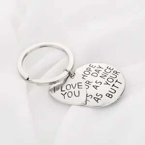 Silver stainless steel keychain set with heart and round charms featuring humorous text