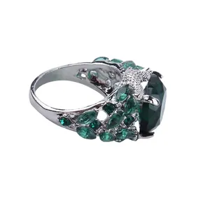 Elegant emerald green marquise cut crystal ring set in silver vintage metal band