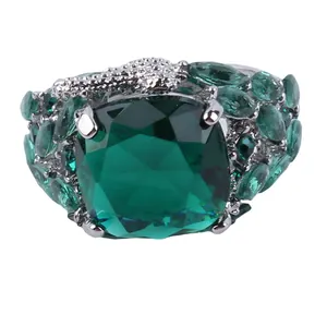 Luxurious silver ring with large square emerald green crystal and marquise side stones