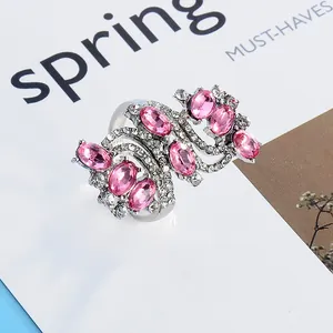 Vintage silver-tone wide ring with oval pink crystals and white rhinestones on magazine