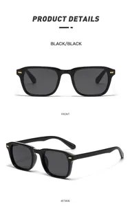 Detail view of vintage square sunglasses with black glossy frame and gold metal rivets