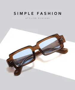 Detail view of tea-brown rectangular sunglasses showing size parameters 49-22-144 on temple