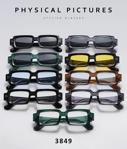 Matrix display of vintage rectangular sunglasses with three-dot metal rivets in various colors