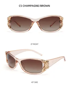 Détail des lunettes de soleil Y2K champagne avec décorations papillon en métal doré