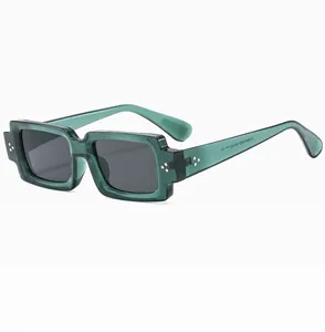 Detailed view of translucent green sunglasses frame with model specs ZN2349 on temple