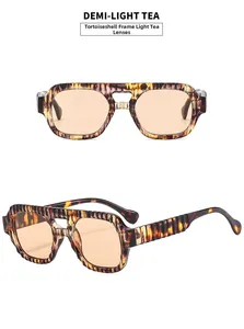 Détail de lunettes aviateur écaillées avec verres thé clair et texture côtelée sur le cadre