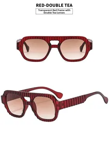 Détails de lunettes aviateur rouges transparentes avec verres dégradés et monture texturée