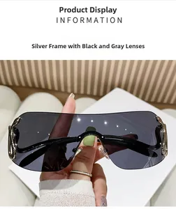 Close-up of rimless oversized sunglasses with silver metal temples and grey lenses