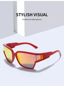 Close-up of red athletic sunglasses with orange reflective lenses and sleek curved frame