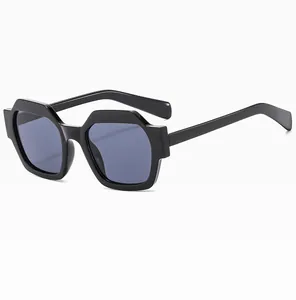 Side view of geometric thick-framed sunglasses with dark grey lenses in black