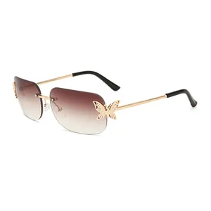 Rimless butterfly sunglasses with brown gradient lenses and rhinestone crystal accents