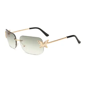 Rimless butterfly sunglasses with gradient lenses and rhinestone insect detail