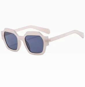 Detail showing the inner arm specifications of cream polygonal geometric sunglasses