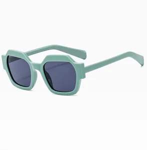 Side view of trendy mint green polygonal sunglasses with dark lenses and thick frames