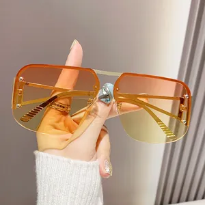 Lunettes aviateur demi-cerclées avec verres dégradés orange et monture métallique