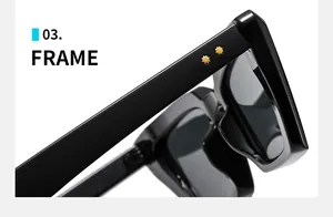 Detail view of black cat-eye sunglasses featuring golden star metal studs on the frame
