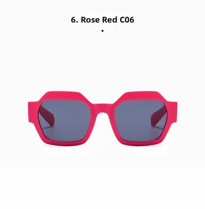 Detail view of bold rose red polygonal sunglasses with thick frames and dark lenses
