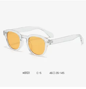 Detail view of round vintage glasses #8101 C-5 with orange lenses and transparent frames