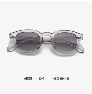 Detail view of translucent grey frame and size specifications on retro round sunglasses