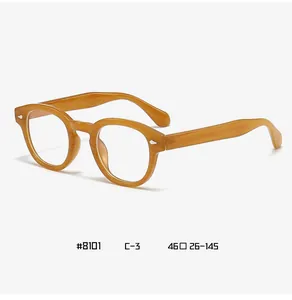 Detail view of round amber eyewear frame #8101 C-3 with silver diamond rivets