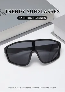 Detail view of matte black oversized cycling sunglasses on a minimalist background