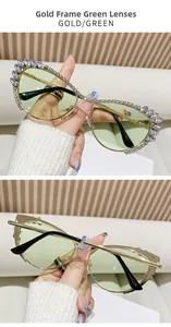 Vue détaillée de lunettes de soleil œil de chat dorées de luxe avec verres verts et diamants