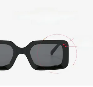 Detail of black rectangular sunglasses frame showing sleek high-stretch temple design