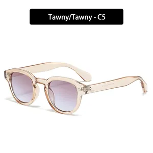 Retro round sunglasses in transparent tawny frames with stylish purple gradient lenses