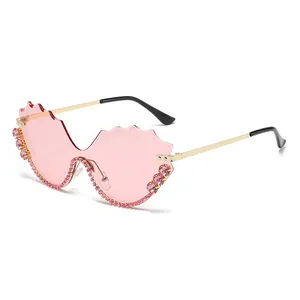 Oversized rimless wave glasses with pink rhinestones and tinted lenses for women