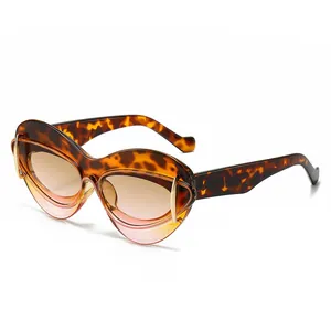 Lunettes de soleil œil de chat écaille avec détails dorés et verres dégradés marron