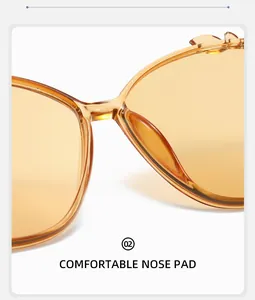 Detail view of comfortable widened nose pads on crystal amber fashion sunglasses