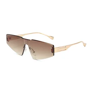 Frameless oversized sunglasses with brown gradient lenses and gold hollow metal temples