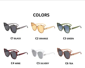 Detailed color selection of cat eye sunglasses with crystal floral accents on frames