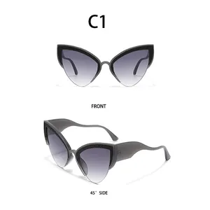 Detail view of cat eye sunglasses with gray gradient lenses and woven texture frames