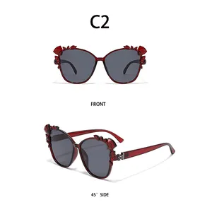 Front and 45-degree side views of dark red oversized sunglasses with crystal details