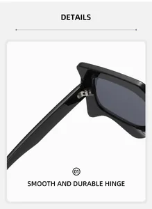 Detail of smooth and durable silver metal hinge on high-gloss black sunglasses frame