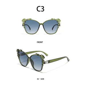 Detailed front and side view of green oversized sunglasses with leaf leaf carvings