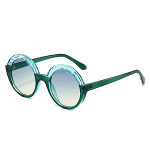 Retro round sunglasses with green translucent rippled frames and blue-yellow gradient lenses